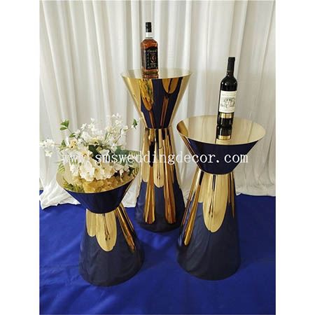 round gold pedestal table